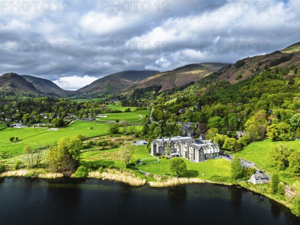 Farms and Mountains over road A591 from a drone, Grasmere Lake, Grasmere, Ambleside, Lake District, Westmorland, Cumbria, UK