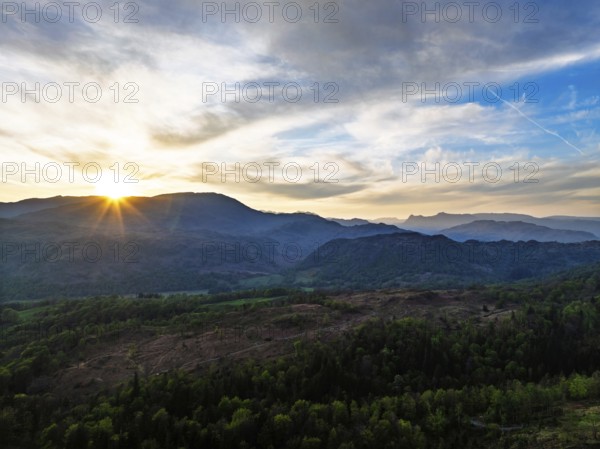 Sunset over Mountains and Coniston Water from drone, Lake District National Park, Cumbria, England, United Kingdom