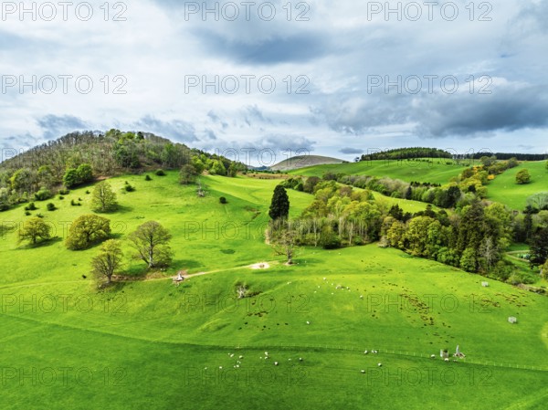 Farms and mountains over Ullswater Lake from drone, Pooley Bridge, Lake District National Park, Cumbria, England, United Kingdom