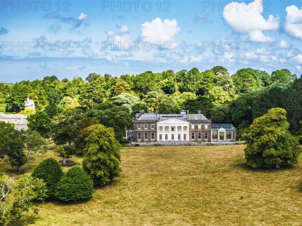 Trelissick House and Garden from drone, Carrick Roads, River Fal, Feock, Truro, Cornwall, UK