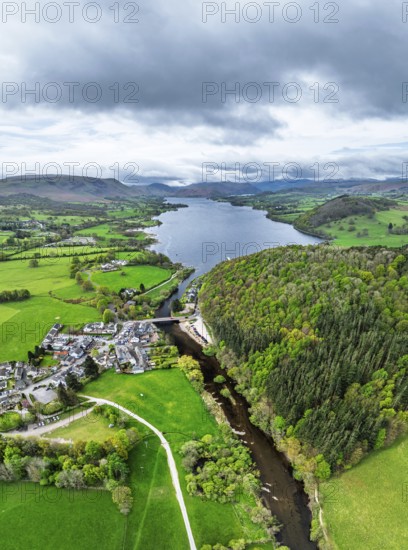 Panorama of Farms and mountains over Ullswater Lake from drone, Pooley Bridge, Lake District National Park, Cumbria, England, United Kingdom