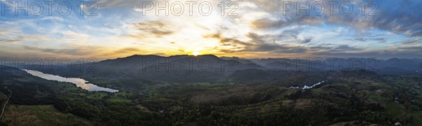 Panorama of Sunset over Mountains and Coniston Water from drone, Lake District National Park, Cumbria, England, United Kingdom