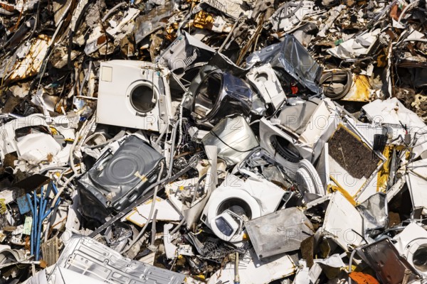 Scrap metal trade in the commercial harbour of Mannheim. Disused household appliances, washing machines and scrap metal. Mannheim, Baden-Württemberg, Germany
