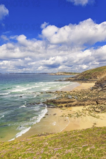 Rolling waves to the beach at a rocky coastline a beautiful sunny day by the sea, Crozon peninsula, Bretagne, France
