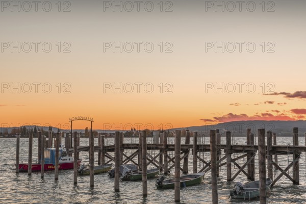 Sunset over a wooden footbridge in Allensbach, Lake Constance, Baden-Württemberg, Germany