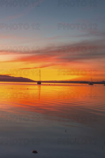 An atmospheric sunset over Lake Constance, Allensbach, Baden-Württemberg, Germany