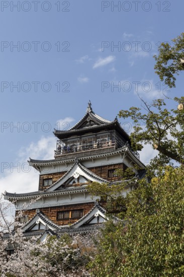 Hiroshima Castle, also known as Carp Castle, against a blue sky, replica of the original destroyed in the atomic bombing, sight, tourist attraction, Naka Ward, Hiroshima, Japan