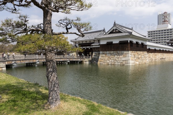 Hiroshima Castle, also known as Carp Castle, entrance gate and moat, replica of the original destroyed in the atomic bombing, sight, tourist attraction, Naka Ward, Hiroshima, Japan