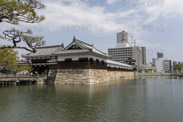 Hiroshima Castle, also known as Carp Castle, entrance gate and moat, replica of the original destroyed in the atomic bombing, sight, tourist attraction, Naka Ward, Hiroshima, Japan