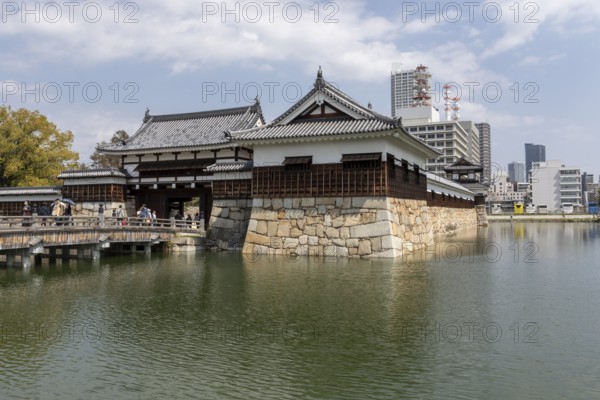 Hiroshima Castle, also known as Carp Castle, entrance gate and moat, replica of the original destroyed in the atomic bombing, sight, tourist attraction, Naka Ward, Hiroshima, Japan
