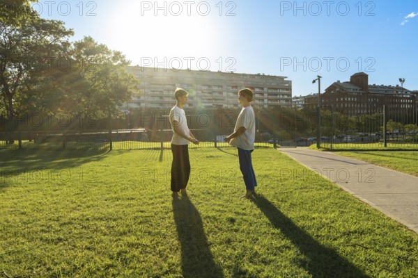 Young martial artists taking a break at sunset