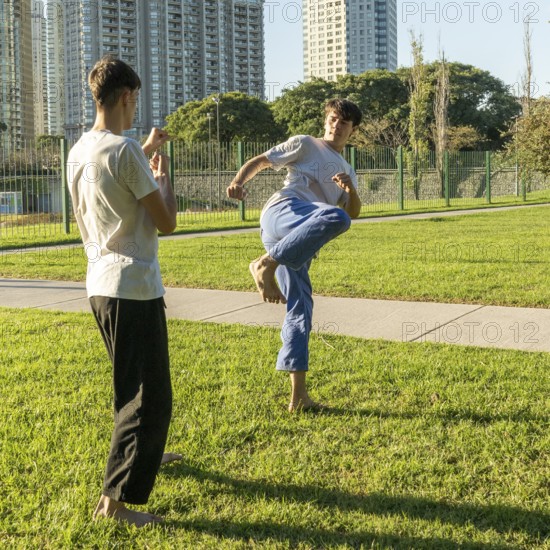 Young martial artists sparring with focus and determination