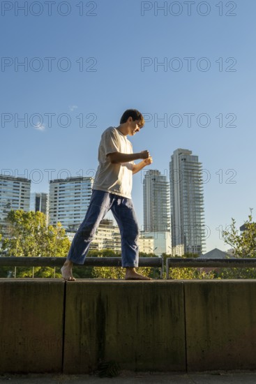 Vertical shot of mastering the art of Jiu Jitsu with a city view