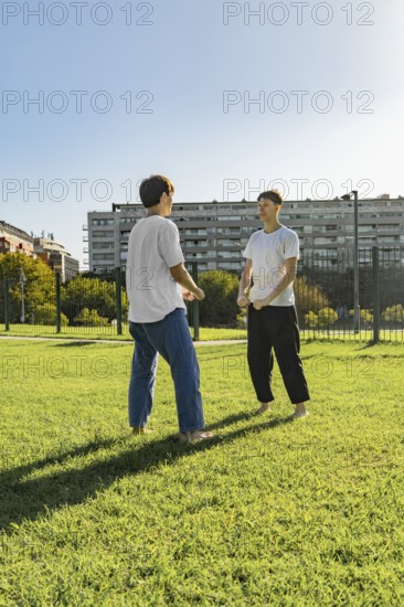 Young martial artists greeting each other before a training session