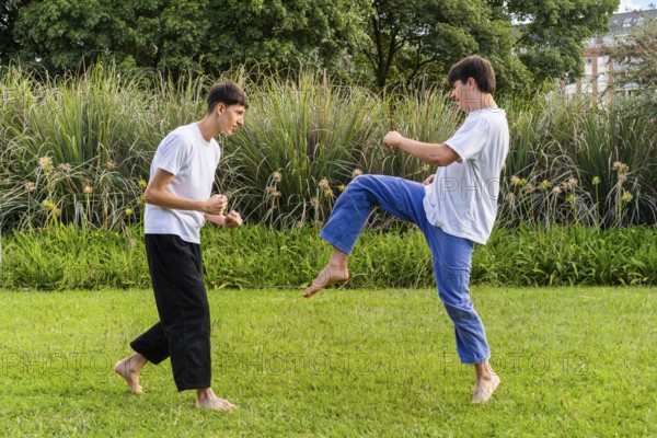 A dynamic Taekwondo session under the sun