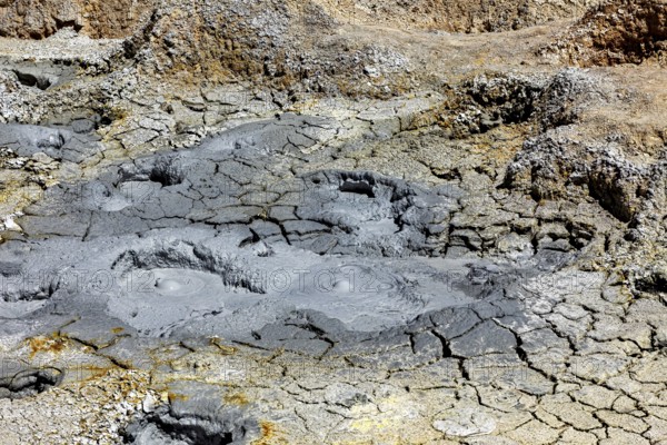 Grey, desolate ground with mud craters and eroded surfaces, the mud volcanoes and fumaroles on the Altiplano in Bolivia