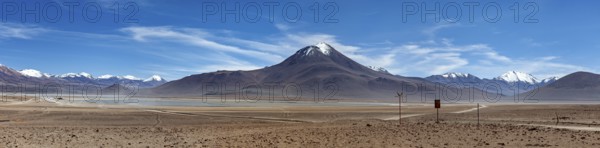 Panorama of a vast desert landscape with snow-capped mountains, The landscape of the Altiplano in Bolivia