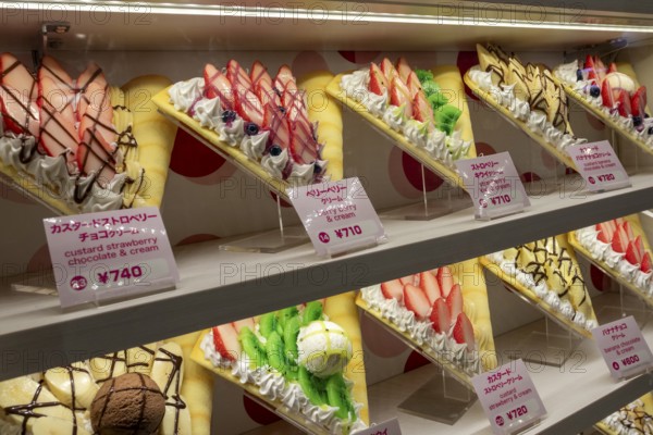 Plastic display specimens in the window of a shop for Japanese crepes in Takeshita-dori, Takeshita Street, alley with souvenir shops and restaurants in the Harajuku district at night, tourist attraction, sight, Shibuya district, Tokyo, Japan