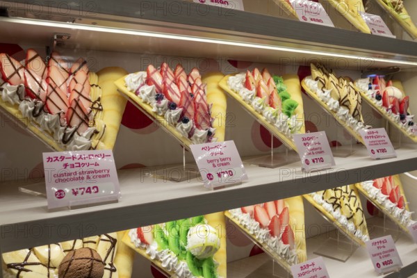 Plastic display specimens in the window of a shop for Japanese crepes in Takeshita-dori, Takeshita Street, alley with souvenir shops and restaurants in the Harajuku district at night, tourist attraction, sight, Shibuya district, Tokyo, Japan
