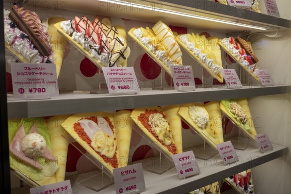 Plastic display specimens in the window of a shop for Japanese crepes in Takeshita-dori, Takeshita Street, alley with souvenir shops and restaurants in the Harajuku district at night, tourist attraction, sight, Shibuya district, Tokyo, Japan