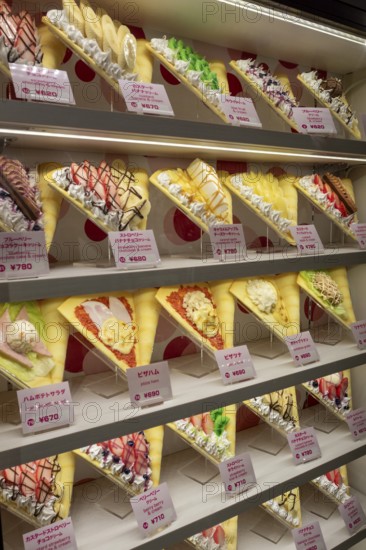 Plastic display specimens in the window of a shop for Japanese crepes in Takeshita-dori, Takeshita Street, alley with souvenir shops and restaurants in the Harajuku district at night, tourist attraction, sight, Shibuya district, Tokyo, Japan