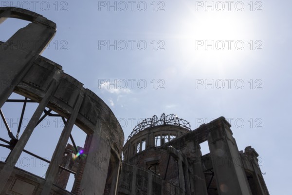 Atomic Bomb Dome, ruins of the former building of the Chamber of Commerce and Industry in backlight, detail view, landmark, UNESCO World Heritage Site, peace memorial and memorial to the victims of the atomic bombing of Hiroshima in the Peace Park, Naka Ward, Hiroshima, Japan