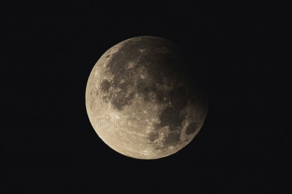 Partial lunar eclipse with detailed crater landscape. Frankfurt am Main, Hesse, Germany