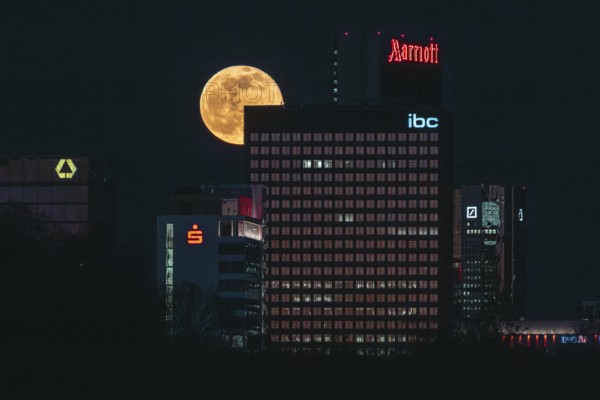 Glowing full moon over the Main metropolis. Frankfurt am Main, Hesse, Germany