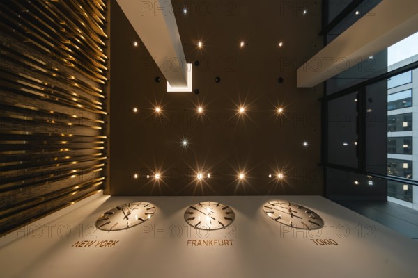 World clock in modern lobby design. Global Tower, banking district, Frankfurt am Main, Hesse, Germany