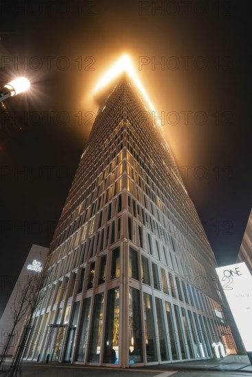 One Tower skyscraper shrouded in fog. One Tower, Frankfurt city centre, Hesse, Germany