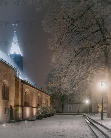Industrial snow in the historic heart. Justinuskirche, Alt Höchst, Frankfurt am Main, Hesse, Germany