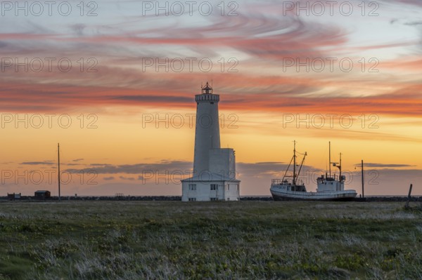 Icelandic lighthouse with a play of colours in the sky. Gardur, Reykjanes, Iceland