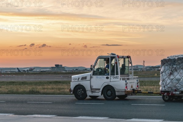 Cargo driver between runway and sunset. Frankfurt Airport, Hesse -Germany