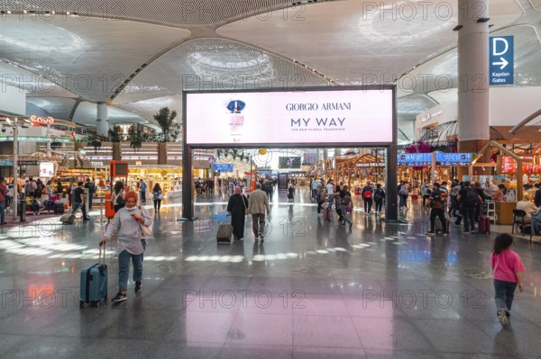 Airport terminal with travellers and shops. Istanbul Airport, Arnavutköy, Istanbul, Turkey