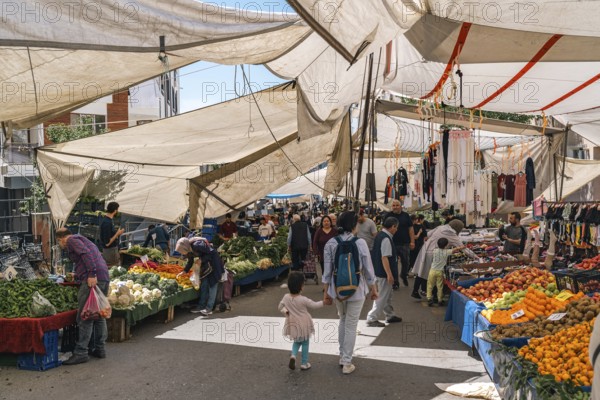 Colourful street market in Istanbul, fresh fruit, vegetables and clothing. Lively and authentic. Ümraniye, Istanbul, Turkey
