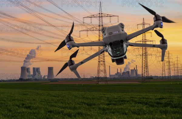 Symbolic image, photomontage, reconnaissance, spying with drones in industrial plants, critical infrastructure, drone flies towards an industrial complex, power plant, spying by camera drones