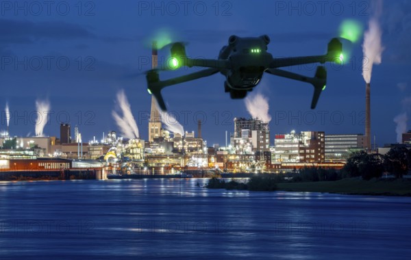 Symbolic image, photomontage, reconnaissance, spying with drones in industrial plants, critical infrastructure, drone flies towards an industrial complex, chemical plant, spying by camera drones