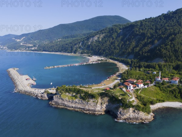Coastal view with pier and green hills, surrounded by clear sea and scattered houses, aerial view, Ginolu Bay, Ginolu, Kastamonu Province, Turkey
