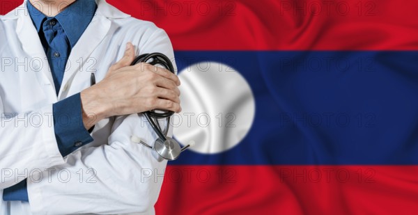 Doctor with stethoscope on Laos flag. Doctor holding stethoscope on Laos flag