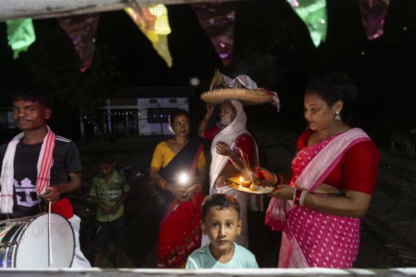 Members of the tea tribe community celebrate the vibrant Karam Festival with traditional rituals at a tea estate in Bokakhat, Assam, India, on 3 September 2025. Karam Puja, one of the most popular harvest festivals, is a celebration dedicated to the Karam tree. This tree symbolizes fertility, prosperity, and all things auspicious. During the festival, Karma dancers carry a branch of the Karam tree while singing and dancing