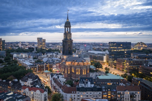 Aerial view of the main church St. Michaelis with a view of Reeperbahn, Dancing Towers and Bunker Hamburg at blue hour, Hamburg, Germany