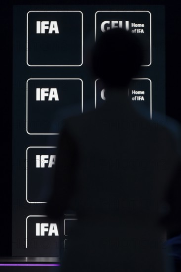 Logos of IFA and GFU behind the silhouette of a person at the opening gala of the IFA Funkausstellung in the CityCube, Berlin, 04/09/2025