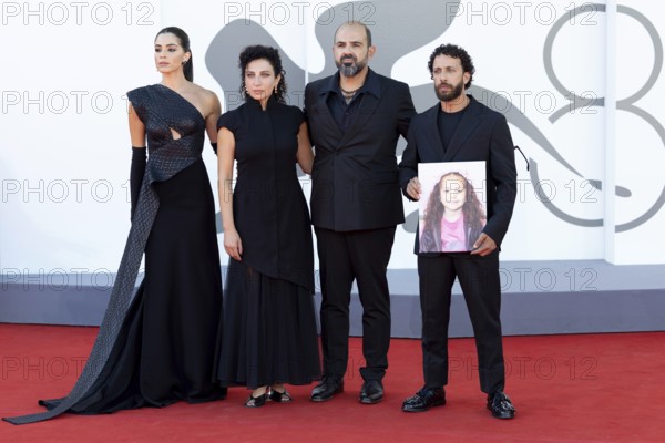 Venice, Italy - 3 September 2025: Saja Kilani, Clara Khoury, Amer Hlehel, Kaouther Ben Hania, Saja Kilani, Motaz Malhees, with a portrait of the five-year-old Palestinian girl Hind Rajab, who was killed by the Israeli army in Gaza in January 2024, during the Red Carpet of - The Voice Of Hind Rajab - during the 82nd Venice International Film Festival