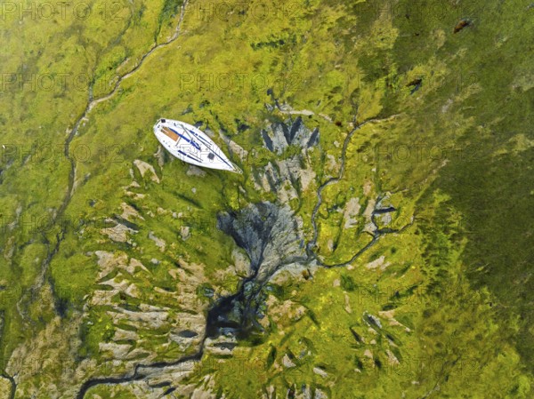 Top Down over boat and mud from drone, Paulsgrove Lake, Portchester Castle, Portchester, Fareham, Hampshire, EnglandDefault