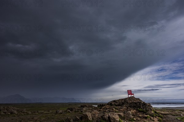 Red chair, artwork, rocks, clouds, storm, rain clouds, coast, mountains, summer, Lón, south-east Iceland, Iceland