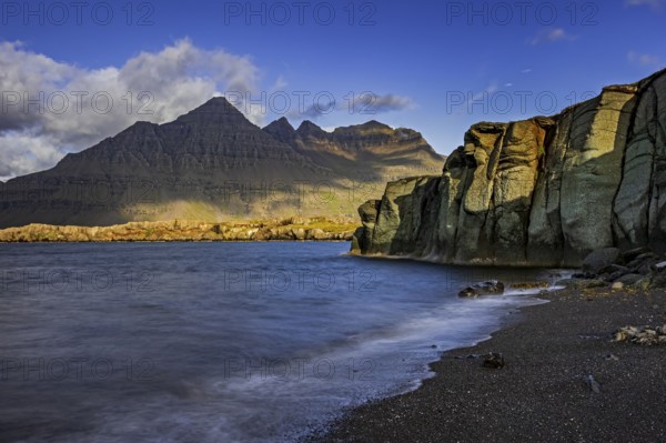 Sea, surf, beach, shore, cliff, mountains, clouds, morning light, long exposure, summer, Berufjördur, Blabjörg cliffs, Teigarhorn behind, East Fjords, Iceland