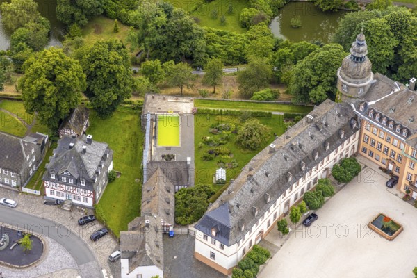 Aerial view, Berleburg Castle, residential castle of the Sayn-Wittgenstein family, water tank, Bad Berleburg, Wittgensteiner Land, North Rhine-Westphalia, Germany, aristocratic family, architecture, exterior view, trees, monument, roofs, heritage, Sayn-Wittgenstein family, building, green, culture, landscape, aerial view, walls, nature, perspective, residential castle, castle complex, sight, summer, small town, tourism, forest, battlements, historical, medieval