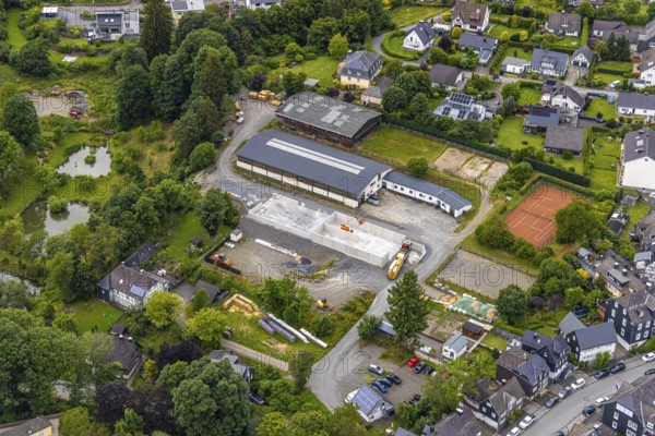 Aerial view, horse farm and riding stable, construction site with new building, tennis courts, residential area Am Herrenacker, Bad Berleburg, Wittgensteiner Land, North Rhine-Westphalia, Germany, Am Herrenacker, architecture, construction work, building materials, construction site, village, roofs, development, leisure, buildings, new building, community, green areas, hobby, houses, infrastructure, landscape, aerial view, nature, new building, horses, horse farm, planning, region, equestrian sports, riding stable, settlement, sports facilities, roads, urban, tennis, meadows, residential area, centre, rural