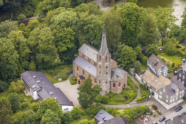 Aerial view, protestant town church and green trees at the Schlossstraße, residential area, Bad Berleburg, Wittgensteiner Land, North Rhine-Westphalia, Germany, architecture, exterior view, tree, village, village life, peace, building, community, green trees, sky, idyll, church, landscape, nature, religion, Ruhr area, Schlossstraße, sight, settlement, summer, town, street, top view, tourism, european, protestant town church, historical