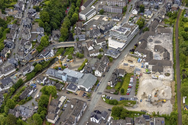 Aerial view, community centre with market square and shops on Poststrasse, savings bank building, multi-storey car park demolition and demolition of the former Eins-A complex on Schulstrasse, Bad Berleburg, Wittgensteiner Land, North Rhine-Westphalia, Germany, demolition, architecture, community centre, demolition, shopping street, Eins-A complex, development, Europe, building, community, shops, real estate, infrastructure, aerial view, market square, multi-storey car park, Poststrasse, region, renovation, Schulstrasse, town, cityscape, streets, structure, urban, historic town